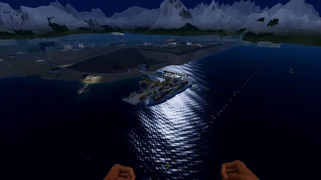 The east harbour at night from the air, with lit quays and cranes