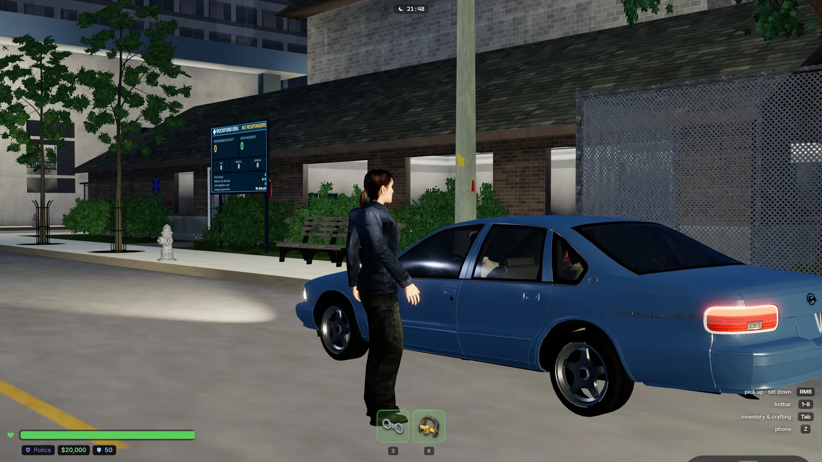 A police officer at a stopped sedan at night, a cruiser with its light bar behind